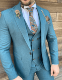 Petrol green wedding suit with structured fabric